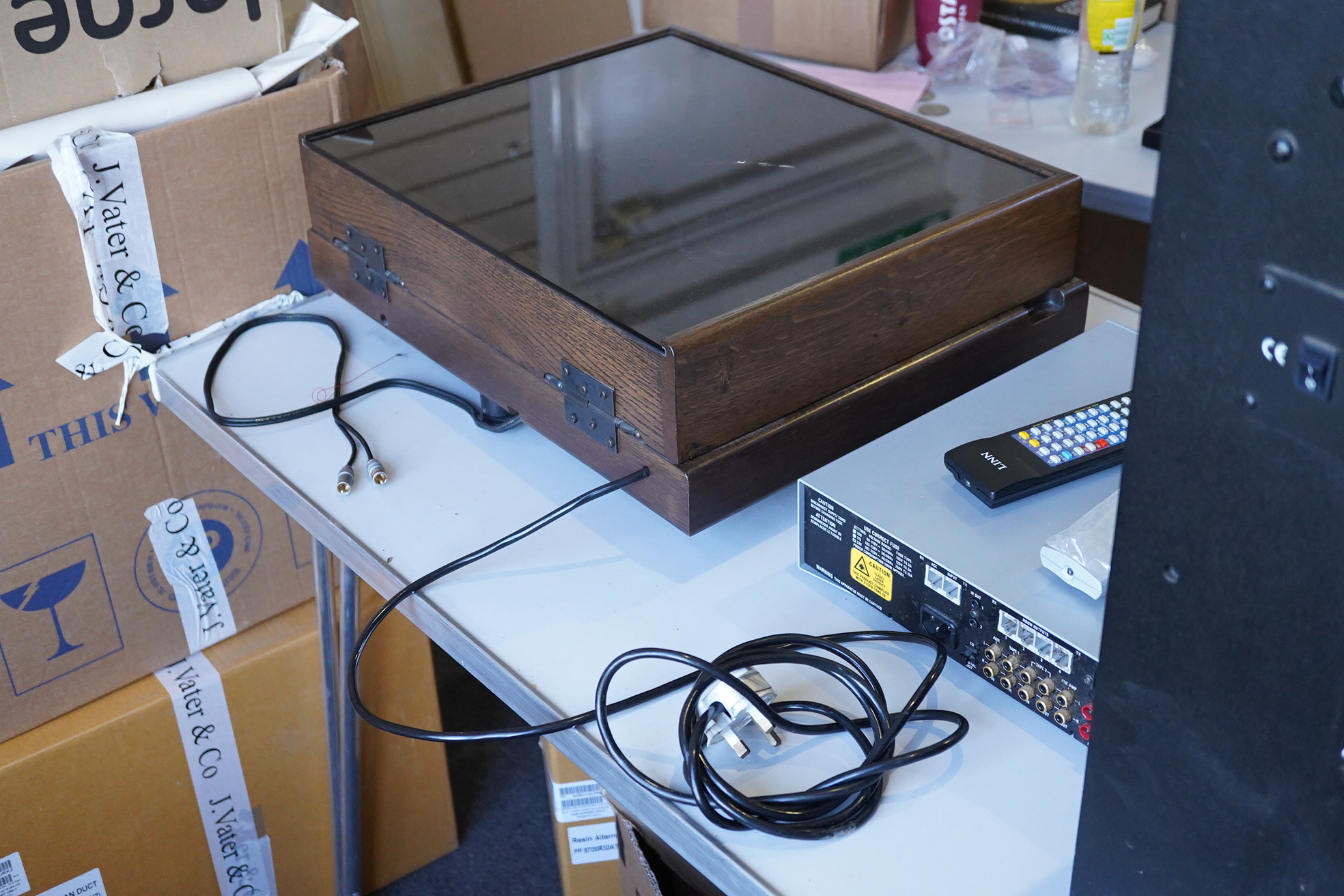 A Kuzma Stabi 2 HiFi turntable record player in a stained oak case